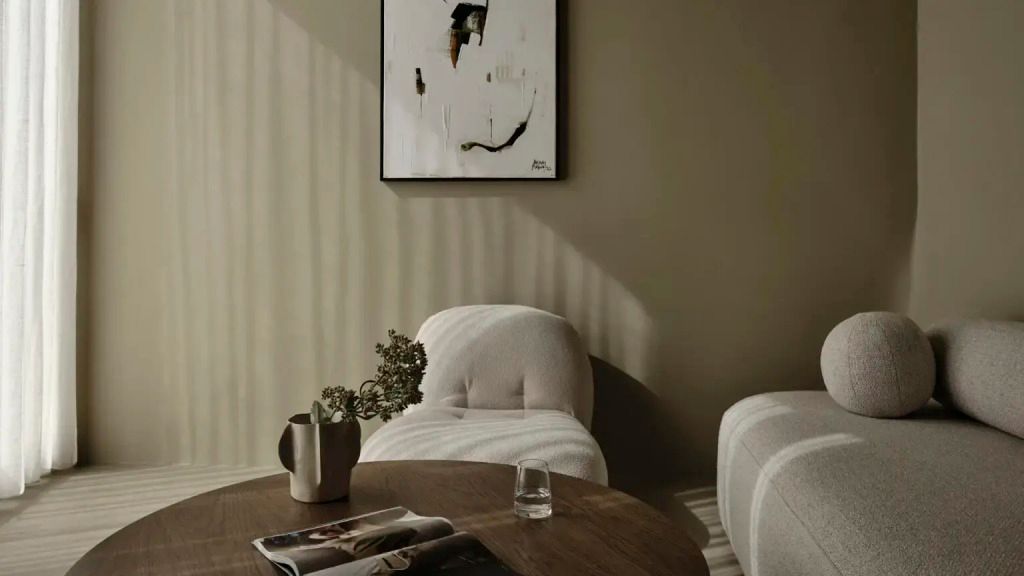 Moderne Sitzecke mit Kunst an der Wand und dezenter Beleuchtung