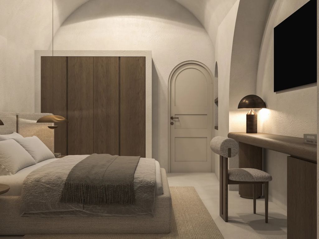 Geräumiges Schlafzimmer mit gewölbter Decke und Holzmöbeln