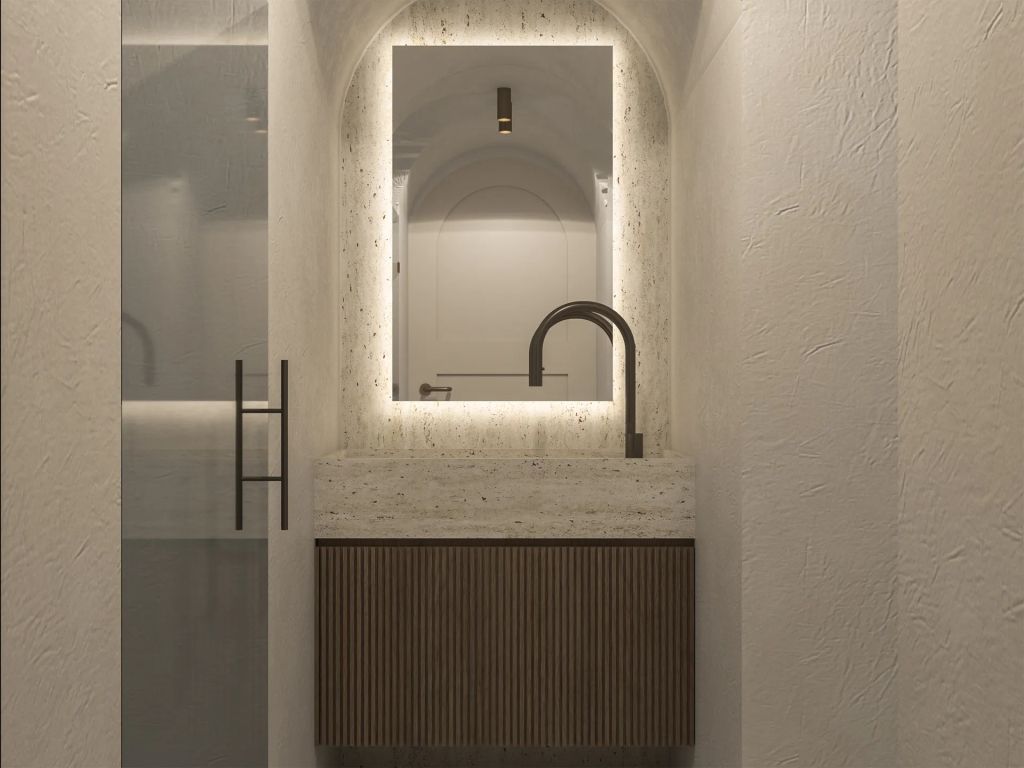 Moderner Waschtisch mit beleuchtetem Spiegel im Badezimmer