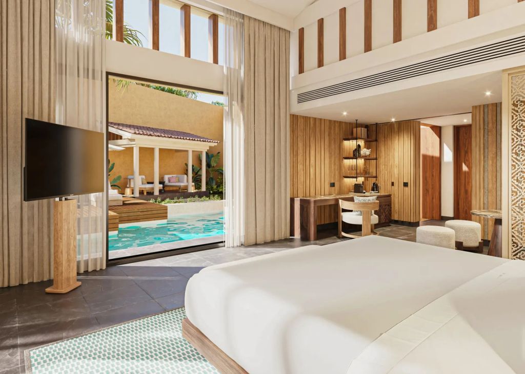 Schlafzimmer einer Villa mit Blick auf den privaten Pool und Holzelementen