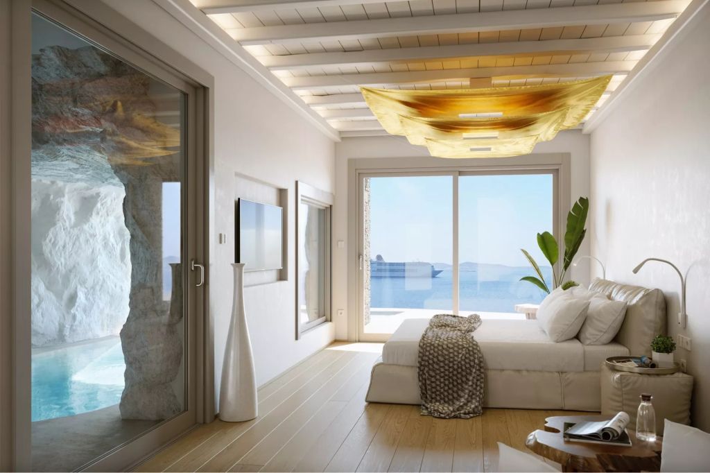 Helles Schlafzimmer mit Meerblick und eleganter Beleuchtung, modernes Design