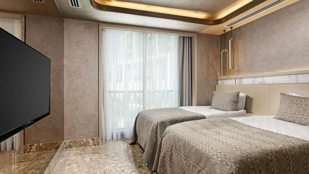 Elegantes Schlafzimmer in der Exclusive Villa mit zwei Einzelbetten und modernen Details