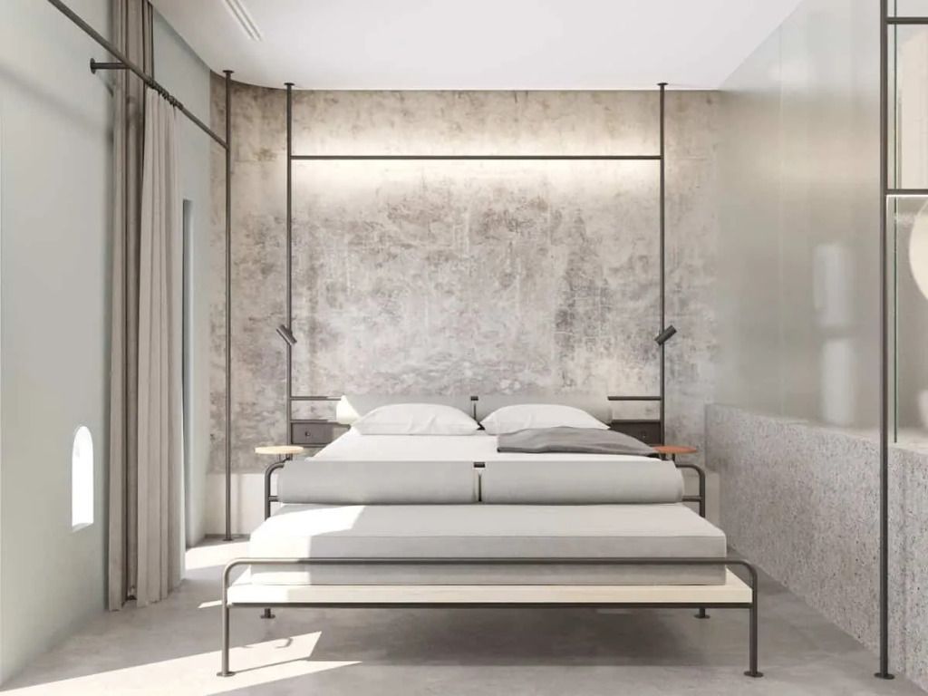 Gemütliches Bett in modernem Zimmer mit industriellem Flair