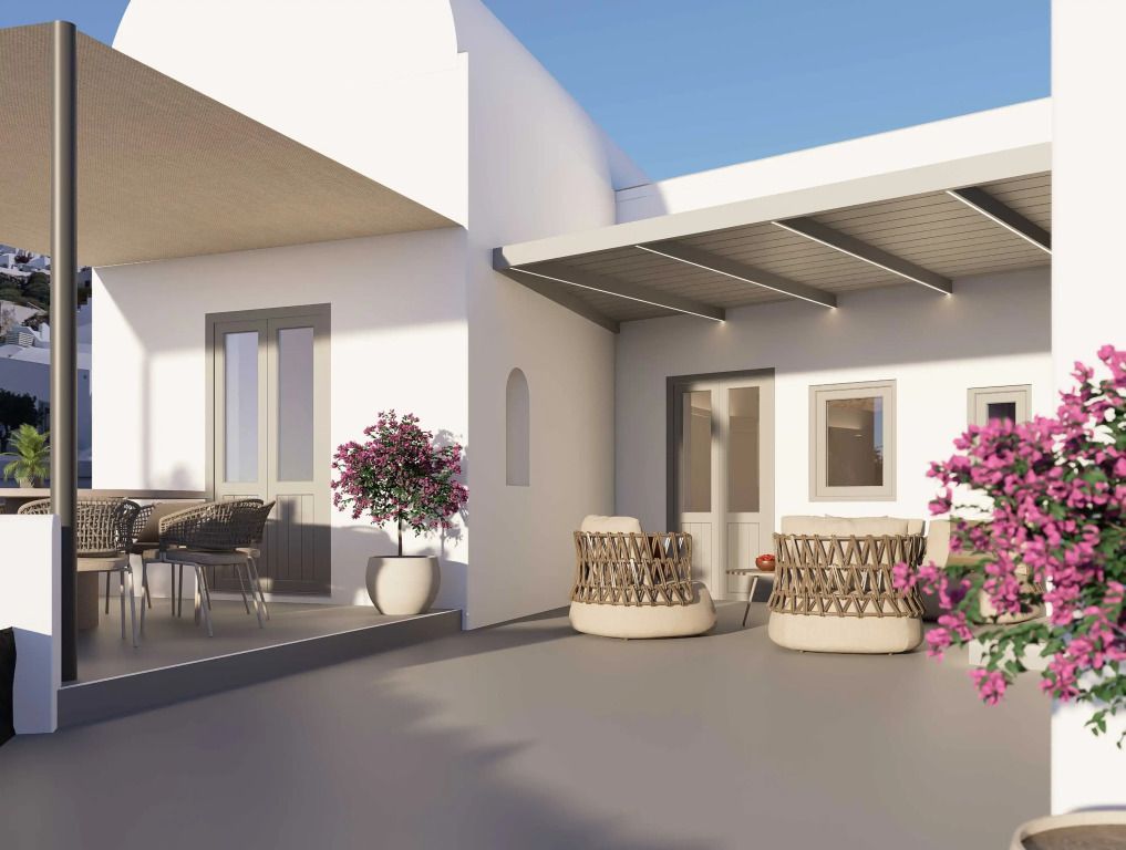 Außenbereich mit Sitzgelegenheit und Blumen am Villa Grace Hotel