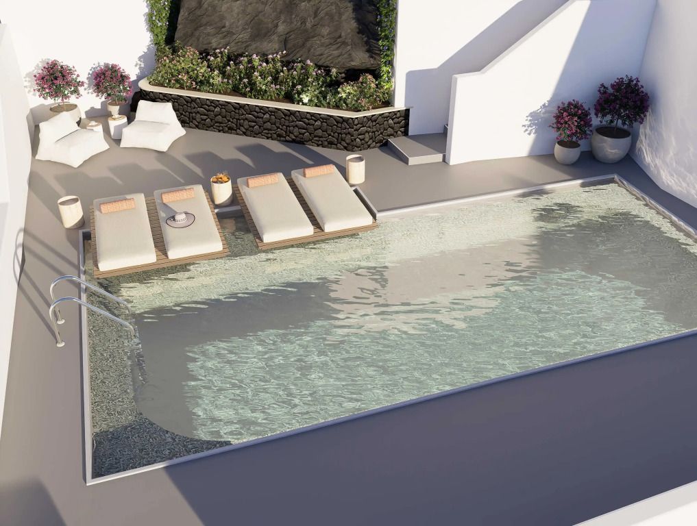 Luxuriöser Poolbereich mit Liegestühlen im Grace Hotel Villa