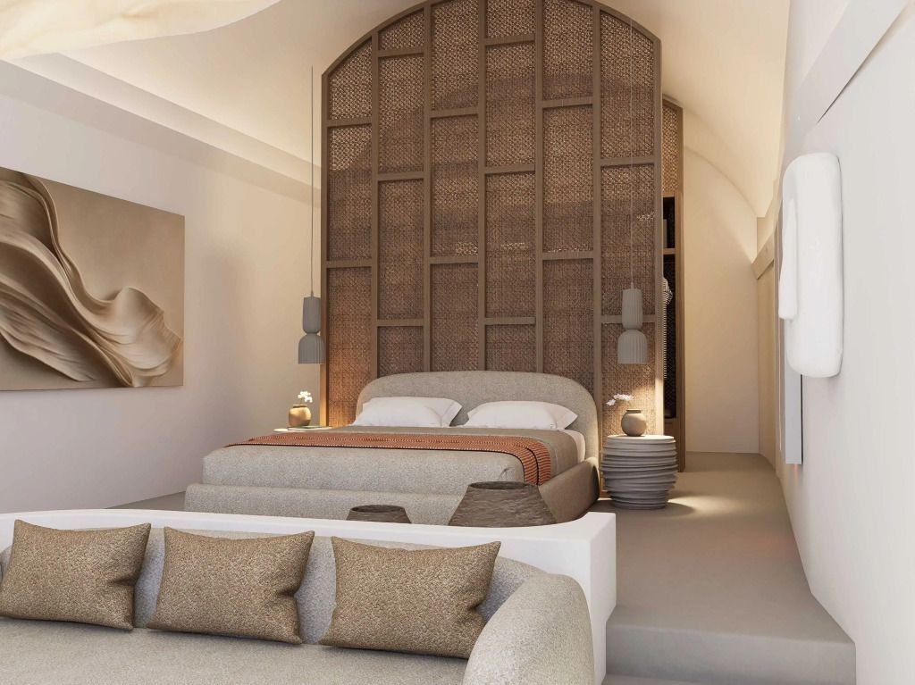 Stylisches Schlafzimmer mit großem Kopfteill und bequemer Couch