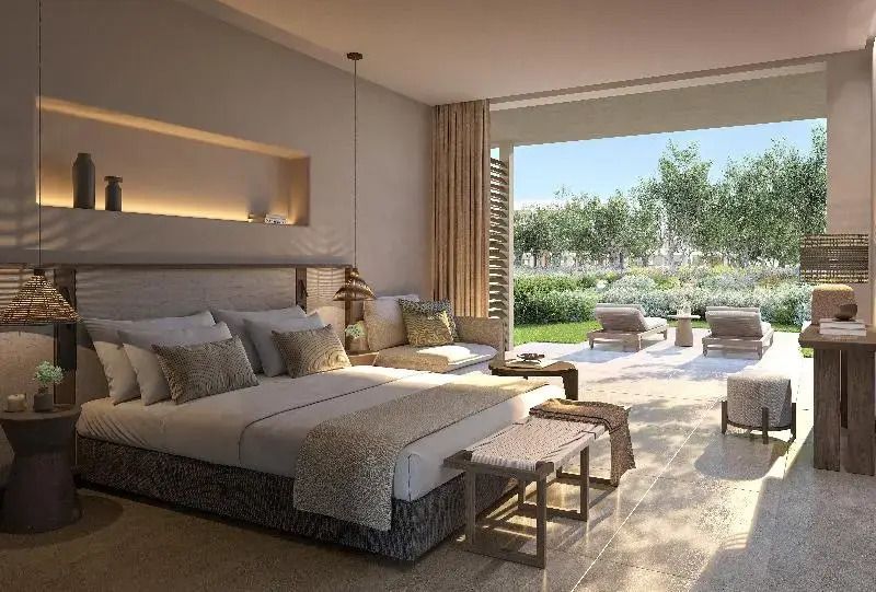 Helles Familienzimmer mit Blick ins Grüne und privater Terrasse im IKOS Kissamos