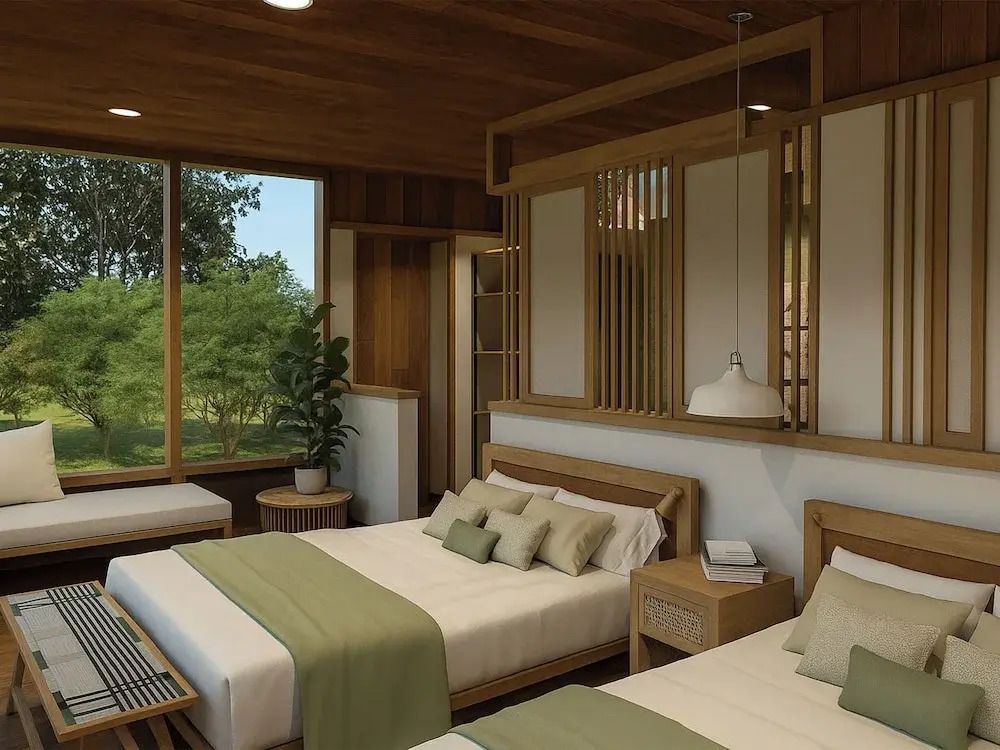 Luxuriöser Schlafbereich im Deluxe Bungalow mit Holzartikeln und eleganten Kissen