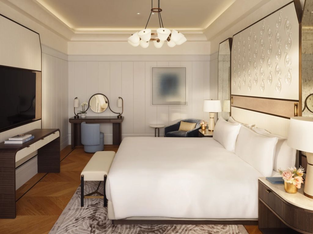 Elegantes Schlafzimmer mit großem Doppelbett in der Mandarin Doppel Suite.