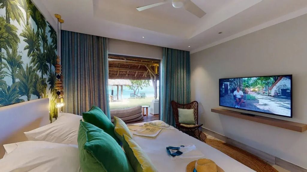Schlafzimmer mit Zugang zur Terrasse und Meerblick in der Paradis Villa
