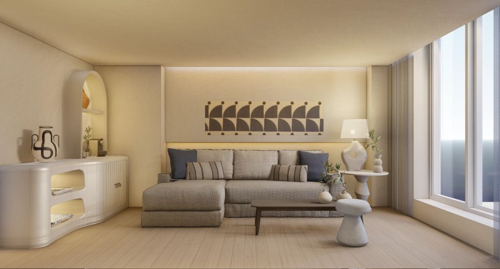 Stilvoller Wohnbereich einer Suite im Patmos Aktis Resort mit gemütlichem Sofa und moderner Dekoration.
