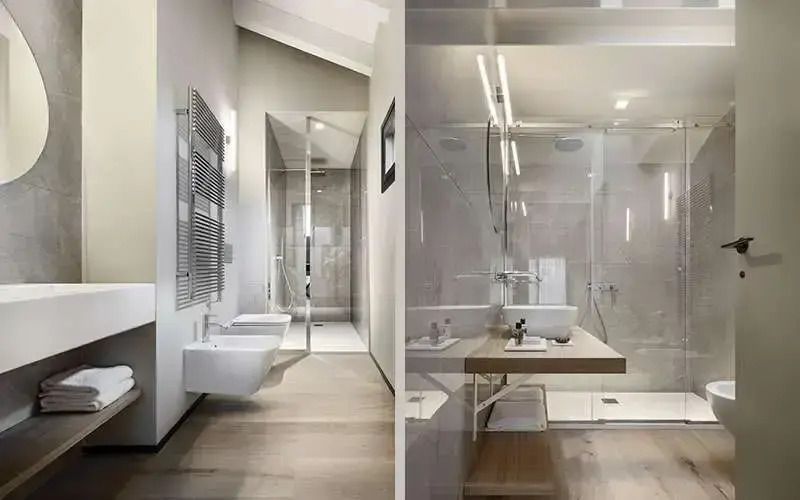 Modernes Badezimmer mit Glasdusche und stilvollem Waschbecken im Deluxe Zimmer
