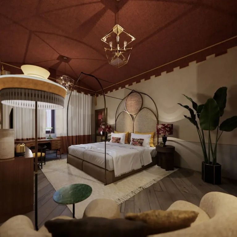Elegant eingerichtete Junior-Suite mit Doppelbett und Pflanzen