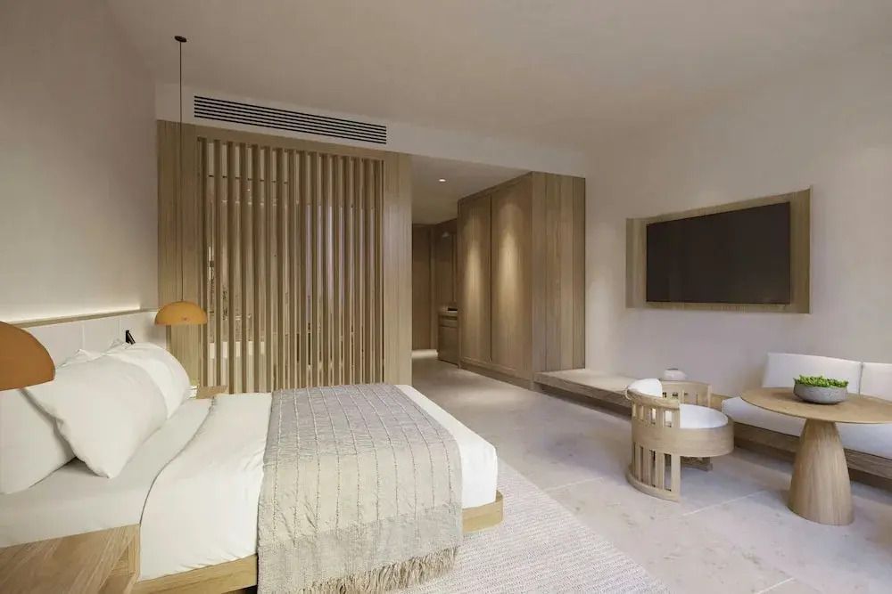 Innenansicht des Superior-Zimmers mit gemütlichem Doppelbett und Holzdetails