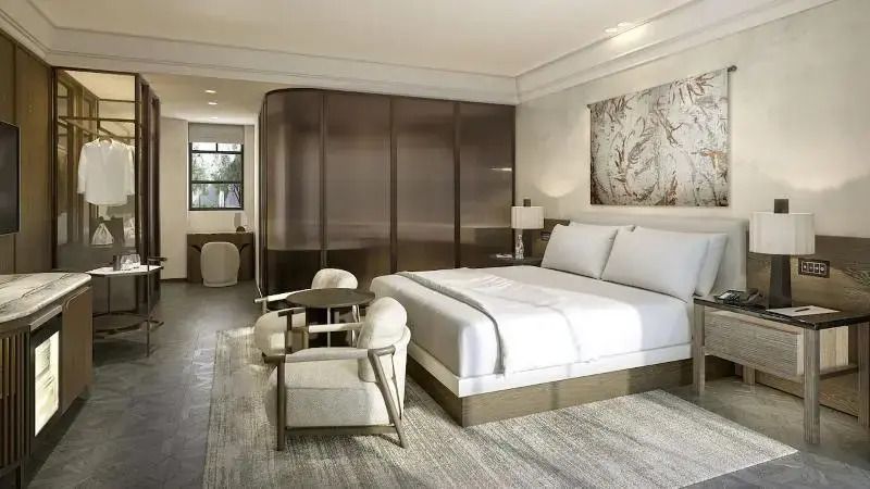 Luxus Schlafzimmer mit großem Bett und moderner Einrichtung in der Standard Suite