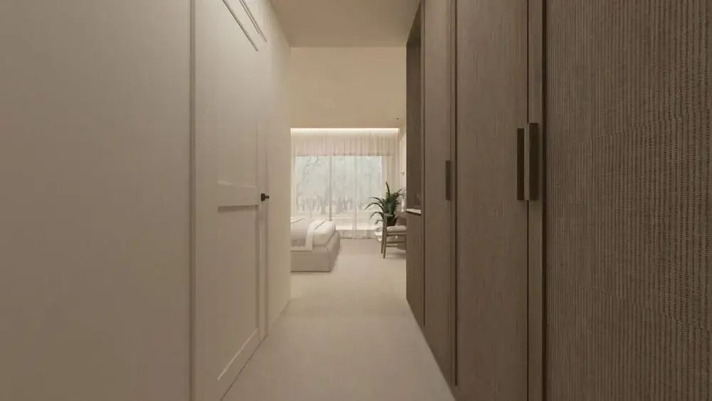 Flur zum Standard Zimmer mit modernen Schränken und einem Blick auf das Bett.