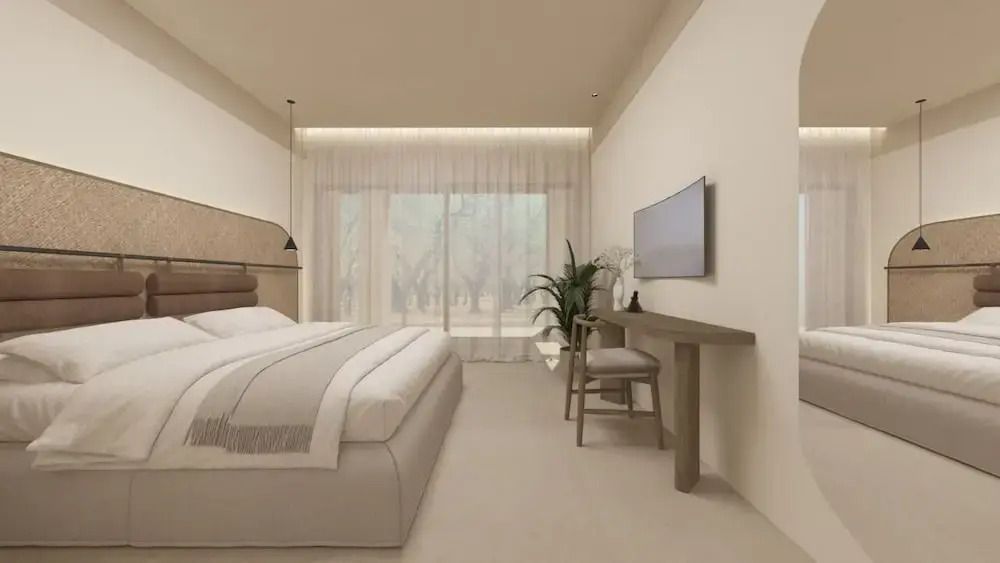 Modernes Standard Zimmer mit Doppelbett, Schreibtisch und großen Fenstern.