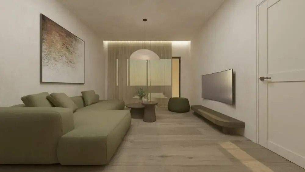 Stilvolles Wohnzimmer mit grüner Couch und Wand-TV in der Villa
