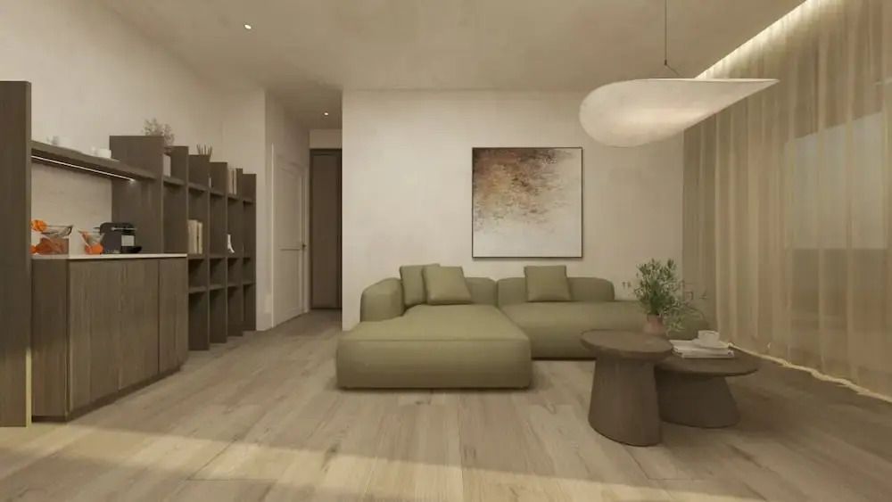 Helles Wohnzimmer mit grüner Eckcouch und Wandkunst