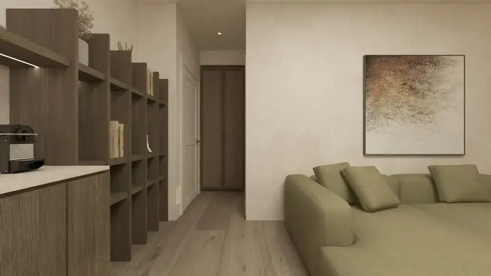 Elegantes Wohnzimmer mit Bücherregal und Sofaecke in Villa