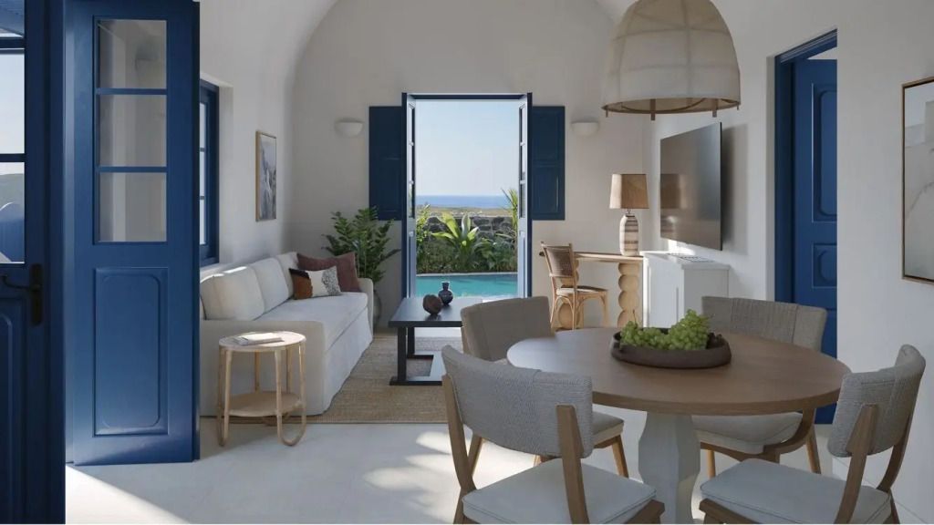 Modernes Wohnzimmer in der Corinthian Villa mit direktem Poolblick und eleganter Einrichtung