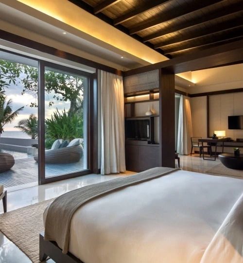 Geräumige Villa mit Doppelbett und Blick auf die Terrasse sowie das Meer