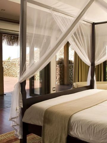 Suite mit Himmelbett und direktem Zugang zur Terrasse