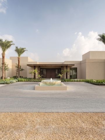Fassade des Bab Al Shams Hotels mit Palmen und Brunnen
