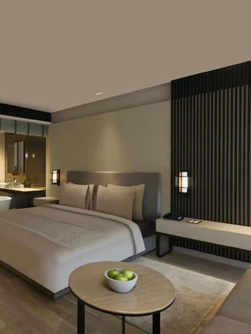 Stilvolles Hotelzimmer mit großem Bett und entspannendem Ambiente
