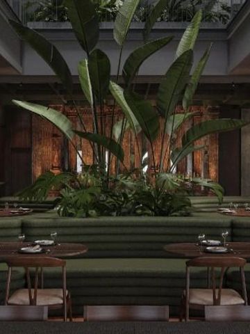 Stilvolles Hotelrestaurant mit großen Pflanzen und moderner Einrichtung
