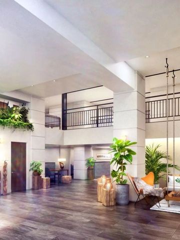 Moderne Hotellobby mit Pflanzen und Sitzbereich