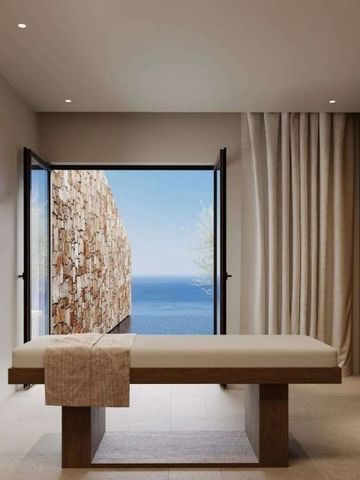 Moderner Raum mit Massageliege und Meerblick
