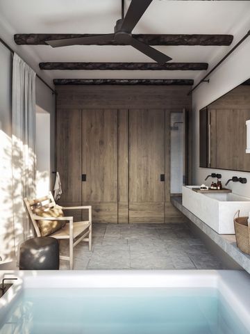 Luxuriöses Badezimmer mit freistehender Badewanne und Holzelementen