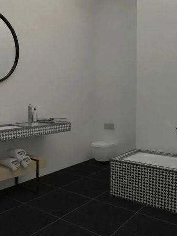 Schickes Badezimmer mit eleganter Badewanne und modernen Armaturen