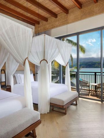 Doppelzimmer mit Himmelbetten und Meerblick im Mango House Seychelles