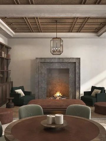 Gemütlicher Lounge-Bereich mit Kamin und Polstermöbeln