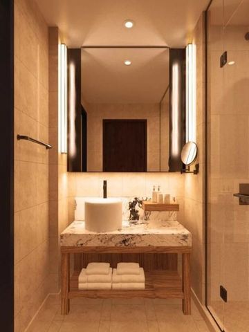 Stilvolles Badezimmer mit Waschtisch und großer Dusche in warmem Licht.