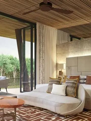 Elegantes Schlafzimmer mit Blick auf Terrasse und Garten im One&Only Nyungwe House