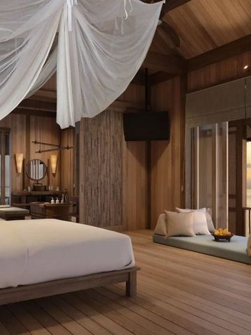 Schlafzimmer mit romantischem Baldachin über dem Bett und Panoramablick auf das Meer.