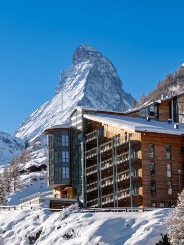 Schneebedecktes Hotel Omnia mit Matterhorn im Hintergrund