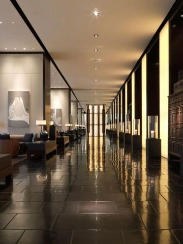 Luxuriöse Lobby mit glänzendem Boden und stilvoller Beleuchtung