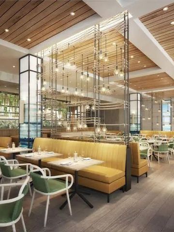 Elegantes Restaurant mit modernen Möbeln und angenehmer Beleuchtung