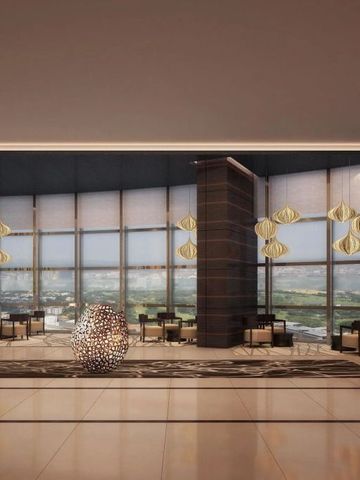 Luxuriöse Lobby mit Panoramafenstern und Designerleuchten.