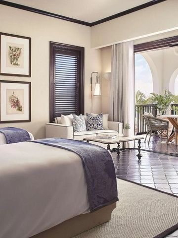 Doppelzimmer mit Balkon und Meerblick im Cap Juluca Hotel