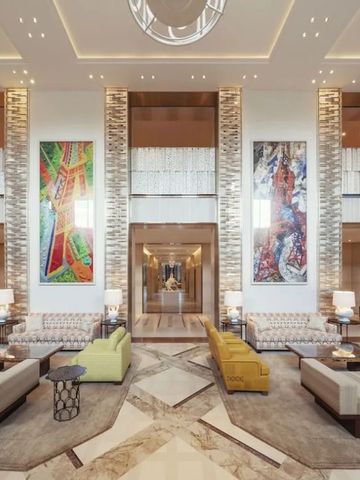 Luxuriöse Hotel-Lobby mit stilvollen Sitzbereichen und Kunstwerken an den Wänden.