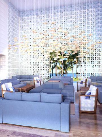 Luxuriöser Loungebereich mit Blick auf Meer und Palmen