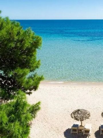 Maldives sand beach with clear blue waters at Forte Village Resort.