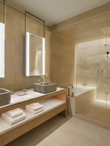 Modernes Badezimmer mit Doppelwaschbecken, beleuchteten Spiegeln und großer Dusche