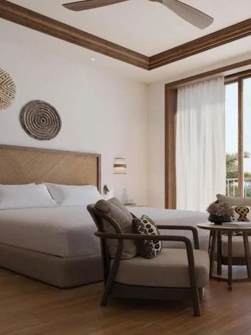 Hotelzimmer mit zwei Betten und einem Balkon mit Blick auf die Umgebung