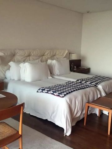 Gemütliches Doppelzimmer mit modernem Design und Holzmöbeln im Hotel Fasano Boa Vista
